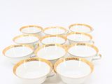 a set of six white and gold cups with gold rims