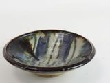 a blue and white bowl on a white table