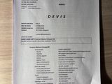 a close up of a paper on a wooden table