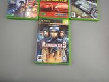 four xbox game covers of different games on a table