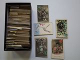 a box full of old postcards sitting on a table
