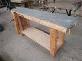 a work bench with a concrete top in a garage