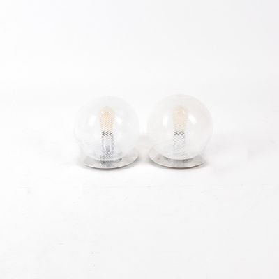 two light bulbs sitting on top of each other