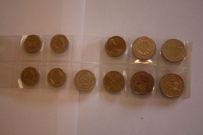 a lot of coins that are sitting on a table