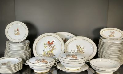 a lot of plates and bowls that are on a table