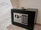 a small safe box sitting on a counter in a room