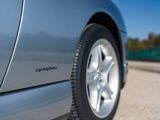 a close up view of a car ' s tire on the road