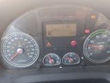 a close up of a car dashboard with various gauges