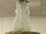 a crystal chandelier hanging from a ceiling in a room
