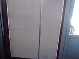 an image of a floor lamp in front of a door