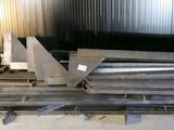 several pieces of metal are stacked on top of each other in a warehouse