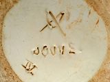 a close up of a plate with a spoon and fork on it