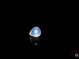 an image of a blue moons stone on a black surface