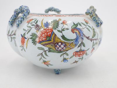 a white bowl with a bird and flowers design on it