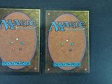 two decks of magic the gathering deck cards on a table