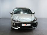 the front view of a silver sports car parked in a showroom