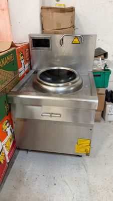 a stove that is sitting in the corner of a room