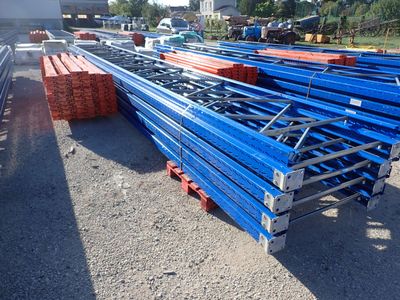 a lot of blue steel beams sitting on the ground