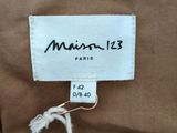 an image of a label on the back of a brown jacket