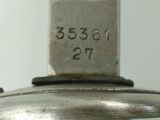 a close up view of a knife with a number on it