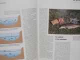 an open book with a picture of a fish on it