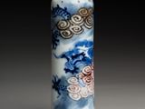 a blue and white vase with a dragon design on it
