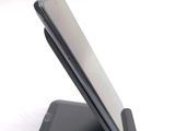 a cell phone that is sitting on top of a stand