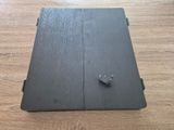 a close up of a laptop on a wooden floor with a lock