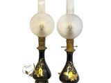 pair of black and gold table lamps with frosted glass lampshads