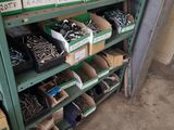 many boxes of screws on the shelves in the garage