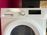 an image of a white washing machine in a room