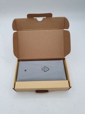 a box with a laptop inside of it on a white surface