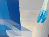a blue and white painting on the side of a building