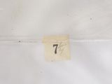 a small piece of paper that has a number on it