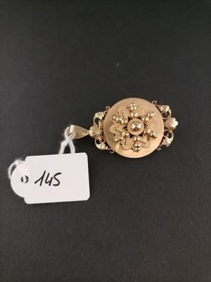 a close up of a gold ring with a tag on it