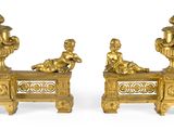 paire de figurines anciennes en bronze représentant un garçon et une fille assis sur un banc