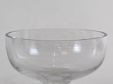a clear glass bowl sitting on top of a table