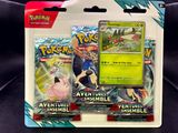 Deux cartes Pokémon se trouvent dans un paquet posé sur une surface noire