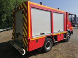 a fire truck that is parked on the side of the road