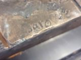 a close up of a statue of a dog on a table