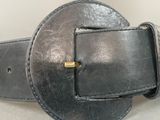 a black belt with a metal buckle on it