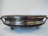 an antique silverplated footed bowl with handles and handles
