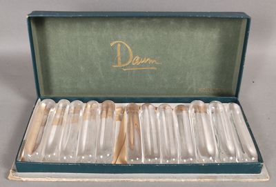 a box with six silver spoons inside of it