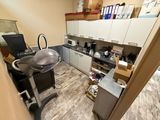 an image of a room with a sink and a desk