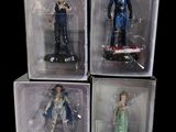 four action figures of a man and a woman in plastic boxes