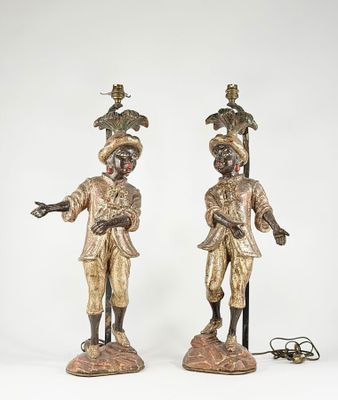 pair of antique bronze figurines of a man and a woman