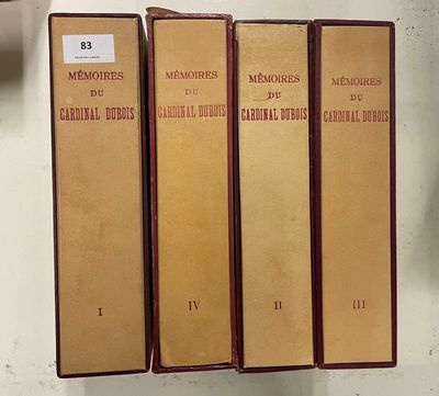 three books are lined up on a shelf next to a clock