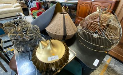 many different types of bird cages sitting on a table