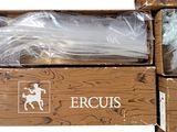 three boxes of various types of scissors in a box on a white surface