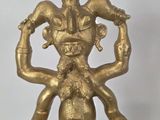 brass figurine of a woman holding a child